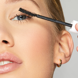 woman applying mascara